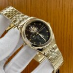 Gold Tommy Hilfiger female chain watch with case